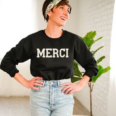 Not French? C'est bon. Over sized crew neck preppy sweatshirt with the French word MERCI printed on the front.  Because you're dang classy. For this design we've selected the top quality, Gildan, Unisex Heavy Blend Crew Neck Sweatshirt for it's cozy comfort, effortless style, and proven durability. This is a shirt you could have forever.  Loose fit, true to size, unisex sizing. Size down for a fitted look. Size up for that over-sized casual feel that we all love and need in our lives. Exclusively designed by Parcel 23, printed in the USA. Select your size and favorite color options, and we'll have it produced and delivered in about a week. Don't hesitate to contact Jami via Etsy Messages if there is anything we can help you with. BIG THANKS for shopping small! parcel23.etsy.com