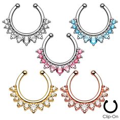 three pairs of piercings with different colored stones on each side and an open nose ring