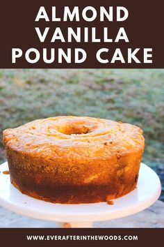 a round cake sitting on top of a white plate with the words, almond vanilla pound cake