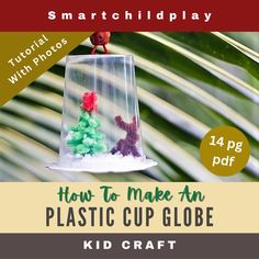 an ornament hanging from a palm tree with the words how to make an plastic cup globe kid craft