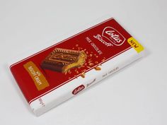 a red and white box that has some kind of chocolate bar on top of it