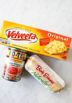 two packages of food sitting on top of a white counter