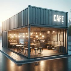 an open container with tables and chairs in front of it at night, lit up by lights