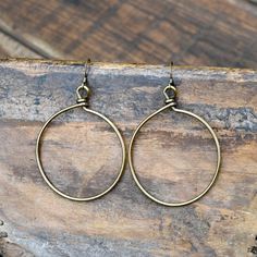 These are antiqued Gold wire wrapped hoop earrings on antiqued Gold ear wire. They hang approximately 2 1/2 inches. Bronze Brass Wire Wrapped Hoop Earrings, Bronze Wire Wrapped Hoop Earrings, Wire Wrapped Brass Hoop Earrings, Wire Wrapped Brass Dangle Hoop Earrings, Wire Wrapped Dangle Hoop Earrings In Brass, Small Metal Hoop Earrings With Soldered Detail, Small Hoop Metal Earrings With Soldered Details, Brass Hoop Earrings With Oxidized Finish, Vintage Wire Wrapped Brass Earrings