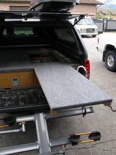 the back end of a truck with an open trunk