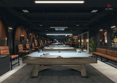 a pool table is in the middle of a room with chairs and tables on either side