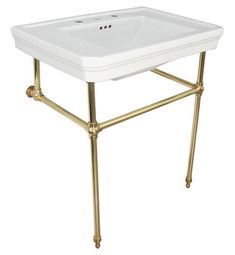 a white sink sitting on top of a gold metal stand with two faucets