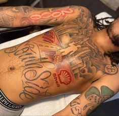 a man with many tattoos on his body