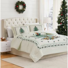 a white bed with christmas decorations on it