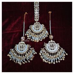 *PRODUCT DETAIL* *Material: Brass *Plating: Gold Plated *Stone: Semi Precious Kundan & Pearls *DIMENSIONS * *Tikka: Weight: 71 gm, Length: 4 Inches, Width: 2.6 Inches, Top Chain Length: 3.12 Inches *Earrings: Weight: 59 gm each, Length: 4.14 Inches, Width: 2.08 Inches *ABOUT PRODUCT* *Beautiful Jadau Kundan Maang Tikka in gold plating and pearl detailing. *Style Tip : A piece to Bring out your Eye for Exclusivity. *DISCLAIMER* *Product & color may slightly vary due to photographic lighti White Latkans Tikka For Ceremonial Events, Traditional Bridal Accessories For Festivals And Celebrations, Meenakari Chandbali Bridal Earrings, Heavy Chandbali Tikka For Wedding, Temple Jewelry Stone Work Danglers For Wedding, Tilla Chandbali Bridal Sets For Celebration, White Chandbali Bridal Sets For Ceremonies, Festive Bridal Meenakari Earrings For Marriage, Traditional Silver Bridal Accessories For Marriage