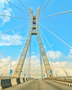 the bridge is very tall and has many cables on it's sides as well