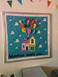 a bulletin board with colorful balloons in the shape of a house and words that read, adventure awaits you