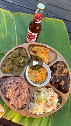 a person holding a plate with different foods on it