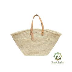 a large straw bag with leather handles on the front and side, sitting against a white background