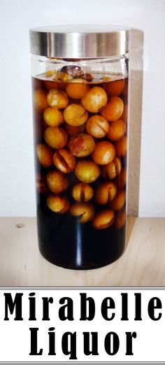 a jar filled with lots of nuts sitting on top of a table