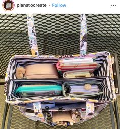 an open purse sitting on top of a metal table