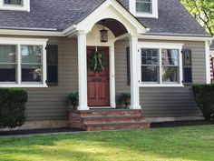 a house with a wreath on the front door