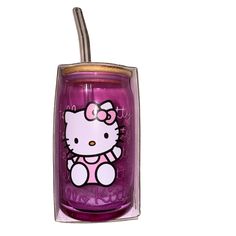 a purple hello kitty tumbler with a straw in it