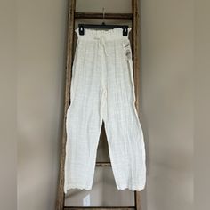 Hit The Beach And Elevate Your Casual Style With These Daily Habit Pants In A Beautiful Ivory Color. The Pants Are Made Of Lightweight Rayon Material And Feature An Elastic Waistband For Comfortable Wear. The Pull-On Closure And Regular Fit Make Them Easy To Wear And Perfect For Summer. The Pants Come In Size M And Have A Solid Pattern That Adds A Touch Of Bohemian Theme To Your Outfit. They Are Not Vintage, Handmade Or Personalized And Are Suitable For Regular-Sized Women. These Pants Are A Gre Casual Cream Wide Leg Pants With Elastic Waistband, Casual High Waist Pants For Daywear, White High-waisted Relaxed Fit Harem Pants, White Harem Pants For Spring Vacation, White Relaxed Fit Summer Pants, White High Waist Harem Pants For Vacation, White Harem Pants With Elastic Waistband For Spring, Cream Bottoms For Beach In Spring, Cream Beach Bottoms For Spring