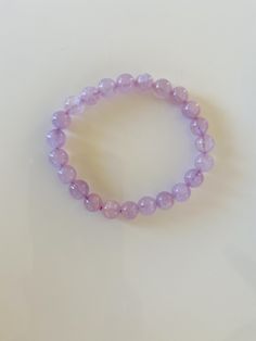 "✨ 8mm Lavender Amethyst Bracelet | Stretch Bracelet | Amethyst Crystal Bracelet | Crystal Jewelry | Purple Bead Bracelet | Women's Bracelet| Amethyst Jewelry | Daya Crystals ✨ Lavender Amethyst is a \"Stone of Wisdom.\" This luminous purple crystal promotes higher levels of consciousness through dreams, intuition, and wisdom. It inspires wisdom through dreams and intuition and instills a sense of luxury from self-knowledge and spiritual insight. Details: ∙ 8mm stones ∙ 7-7.5 inches in length Sh Lavender Beaded Bracelets With 8mm Beads For Gift, Lavender 8mm Beads Jewelry For Healing, Lavender Bracelet With 8mm Beads For Meditation, Lavender Crystal Bracelet With 8mm Beads As Gift, Lavender 8mm Beads Bracelet Gift, Lavender Bracelets With Round Beads For Meditation, Lavender Bracelets With 8mm Beads, Lavender Meditation Bracelets With Round Beads, Lavender Round Beads Bracelets For Meditation