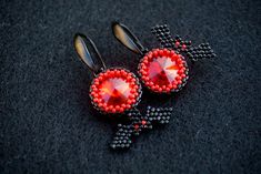 This earrings was made from black japanese MIYUKI and shimmer red glass crystals These earrings can be a great gift for your family and friends for the Halloween holiday. Also you can buy them for yourself on Halloween as an addition to your costume or separately as decorations for creating a festive mood. Available in a different color, just contact me All products are 100% hand made, made with love especially for you Please note that due to lighting effects, monitor's brightness, contrast and Handmade Black Vampire Earrings, Handmade Red Crystal Earrings For Gift, Red Earrings As Halloween Gift, Red Earrings For Halloween Gift, Red Drop Earrings For Halloween, Handmade Black Crystal Earrings For Party, Bright Jewelry, Black Japanese, Bat Earrings