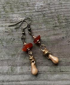 "Don't look now! Soon the seasons will be changing. The trees will shed their leaves as the earth goes into a season of rest.  With that in mind, these earrings were created with brown glass beads and copper pinecone charm. Each earring is  handmade to replicate one of my favorite seasons.  They are about 1.5\" in length and made with brass hardware. If you have any questions please feel free to message me anytime." Rustic Brown Brass Earrings, Nickel Free Brown Earrings With Czech Glass, Nickel-free Brown Earrings With Czech Glass, Nickel-free Brown Czech Glass Earrings, Brown Dangle Earrings Nature-inspired, Nickel-free Brown Czech Glass Jewelry, Nature-inspired Brown Dangle Earrings, Earthy Brown Copper Earrings, Nickel-free Brown Beaded Dangle Earrings