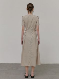 This product, designed as a neck strap belt dress, offers a fusion of modern and traditional elements, creating a piece that's both unique and versatile. With its understated elegance, it serves as a canvas for personal styling, whether with bold accessories or a minimalist approach. Its structure provides a flattering fit, while the addition of the neck strap adds a touch of contemporary flair. - The dress is meticulously tailored to accentuate the waistline with its belt detail.- Its knee-length cut strikes a balance between sophistication and comfort, suitable for various occasions.- The neck strap feature introduces a modern twist to the classic silhouette.- Constructed from a premium fabric, the dress ensures both durability and ease of movement. Elegant Beige Cotton Midi Dress, Beige Belted Cotton Dress, Elegant Fitted Cotton Belted Dress, Elegant Belted Cotton Maxi Dress, Elegant Cotton Belted Dress For Work, Bold Accessories, Belt Dress, Dress Beige, Understated Elegance