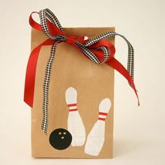 a brown paper bag with bowling pins on it