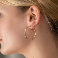 Our beautiful handmade Gold 3mm Clasp Hoops are a perfect addition to any look. These offer a bolder look without the extra weight, and are a step up in thickness when compared to our regular clasp hoops. 14k Gold Filled 3mm Thickness Available in Small (18mm), Medium (25mm), and Large (34mm) The perfected clasp on each earring makes it easy to put on and take off. Small Hoop Gold-plated Earrings With Lever Back, Adjustable Small Hoop Gold-plated Earrings, Tarnish-resistant Gold-tone Brass Hoop Earrings, Gold-tone Hardware Small Hoop Earrings, Yellow Gold Tarnish-resistant Brass Hoop Earrings, Gold Filled Earrings, Handmade Gold, Recycled Metal, Free Giveaway