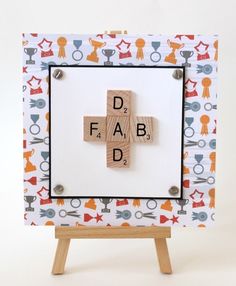 a cross made out of scrabbles on a white background