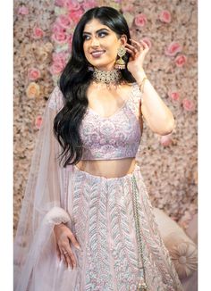 True grandeur comes out through the dressing style with this adorning blush pink colored majestically artistic lehenga enriched with intricacy of silver embroidery and reshim work. Prettified with appealing embroidered work within the attire adds a sign of elegance statement to your look! Color -Blush Pink Fabric & Work Style -- Net fabric with silver reshim embroidery. Details -- Assured quality.- Wash care instruction: Dry clean only.- Slight variation in color is possible due to digital p Glamorous Pink Lehenga With Intricate Embroidery, Pink Sequined Anarkali Set For Wedding, Elegant Pink Choli With Mirror Work, Bollywood Style Pink Gown With Sequins, Bollywood Style Pink Sequined Gown, Pink Bollywood Gown With Sequins, Traditional Pink Sequined Gown, Designer Hand Embellished Pink Anarkali Set, Pink Hand Embellished Choli For Designer Wear