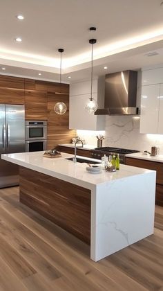 a modern kitchen with white and wood accents