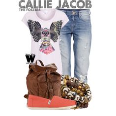 a woman wearing ripped jeans and an owl t - shirt is standing next to her purse