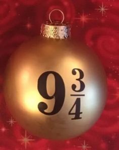 a golden ornament with the number nine on it