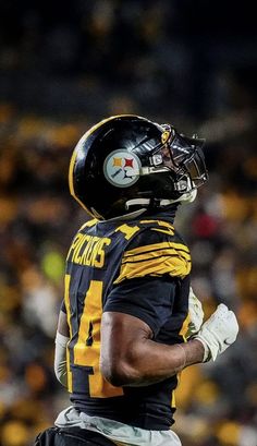 a football player wearing a helmet and gloves