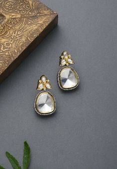 Classic, elegant & Effortless silver, gold, polki victorian earrings. Based in copper with rhodium plating and high grade glass polki. A perfect accessory for almost anything. It will go with everything and make your outfit super chic.These Earrings set have an excellent finish and gives out an exquisite sense of style. Perfect to wear to dinner, and perfect gift for family members, friends or bridesmaid. LENGTH Earrings Length - 3 cm Closure - Push Pin with a Clip DETAILS -100% top Quality Ornate Gold Dual-tone Earrings, Silver Danglers With Elegant Design For Festive Occasions, Festive Silver Danglers With Elegant Design, Elegant Silver Kundan Danglers, Ornate Dual-tone Gold Earrings, Ornate Dual-tone Earrings For Gift, Ornate Dual-tone Earrings As Gift, Ornate Dual-tone Earrings Gift, Elegant Dual-tone Earrings For Formal Occasions