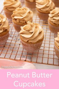 cupcakes with peanut butter frosting on a cooling rack