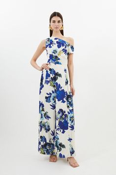 Bursting with vibrant floral prints, this jumpsuit is tailored for a flattering fit. Presented with a drop shoulder design and an airy wide leg trouser design. Finished with a pleated panel for an updated touch, pair this piece with barely there heels and golden accessories for spring occasionwear.Floral printDrop shoulderWide legFrom standout race day dresses to new-season wedding guest dresses, discover our elegant occasionwear collection. Blue Floral Jumpsuit, Golden Accessories, Elegant Jumpsuit, Trouser Design, Wedding Guest Dresses, Floral Jumpsuit, Shoulder Design, Race Day