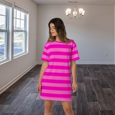 Looking for a cute and comfortable dress for your next vacation? Look no further than our dark and light pink striped T-Shirt Dress, inspired by a grinning cat! With a loose and flowy fit, this dress is perfect for staying cool and comfortable in warm weather. Plus, it's available in plus sizes, so it's perfect for every body! Made from soft and breathable fabric, this dress is ideal for all kinds of activities, from sightseeing to shopping to lounging on the beach. The fun and unique design, fe Striped Dresses With Short Sleeves And Relaxed Fit, Striped Dresses With Relaxed Fit And Short Sleeve, Striped Relaxed Fit Short Sleeve Dresses, Casual Pink Loungewear Dresses, Trendy Pink Crew Neck Dress, Trendy Striped Short Sleeve Dress, Casual Pink Crew Neck Dress, Striped Short Sleeve Relaxed Fit Dress, Pink Crew Neck Lounge Dress