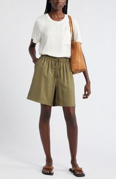 Slip into the casual ease of loose-fitting shorts topped with a comfortably customizable drawstring waist. Elastic/drawstring waist 91% viscose, 9% polyester Machine wash, line dry Imported Spring Bermuda Bottoms With Drawstring, Casual Bottoms With Drawstring Tie, Casual Wide Leg Workwear Shorts, Casual Wide-leg Workwear Shorts, Relaxed Fit Viscose Bottoms For Vacation, Casual Bottoms With Drawstring Tie For Summer, Casual Summer Bottoms With Drawstring Tie, Casual Spring Shorts With Functional Drawstring, Casual Vacation Shorts With Tie Waist