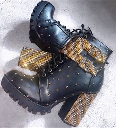 Tudor Queendom Costume Boots (Inspired by Six The Musical) Custom designs available!  Example boots are for the character of Catherine of Aragon. Catherine of Aragon boots include the colour's Bronze, Gold and Rose Gold. Shoe size, heel height, colours and gem types (e.g. standard rhinestones or Swarovski) can all be made to order and if you wish to have your own pair customised this can be arranged, this price includes the double rhinestoned buckle. Contact me with any questions or queries and I've be happy to do them. All made with non-toxic and washable glue.  Please not the dispatch time when you order - if you need them more urgently please send me a message. *Not official merchandise and the designs from the show will not be copied * The price stated is to cover material and labour c Catherine Of Aragon Costume, Six The Musical Boots, Gold Boots With Reinforced Heel And Round Toe, Gold Heeled Boots With Reinforced Heel And Round Toe, Trendy High Heel Boots For Festival, Trendy High Heel Boots With Rivets, Gold Heeled Boots With Round Toe For Winter, Party Boots With Rivets And Round Toe, Party Boots With Spikes And Round Toe