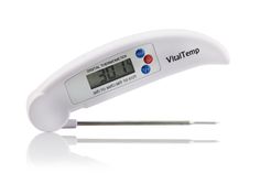 a digital thermometer with two needles in front of it on a white background