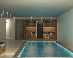 an indoor swimming pool with spa tub and jacuzzi