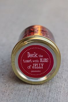 a red and gold tin with a label on it that says, peek into the toast with blobs of jelly