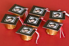 graduation caps with pictures tied to them on a red tablecloth and decorated with twine