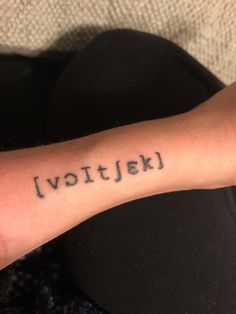 a person with a small tattoo on their arm