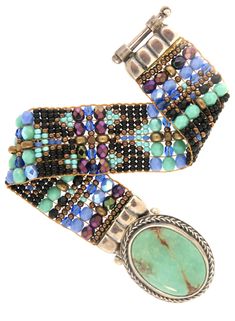 Chili Rose Mini Aragon Turquoise & Jet Bracelet -Aragon Turquoise Stone lays in the middle of the Bracelet when on the wrist -Hand Beaded on a Loom -Blue and Black with a soft shimmer of turquoise mix Beads -Looks gorgeous with a LBD or your Favorite Jeans and White T! -Sterling Silver -Clasp Closure -Made in Santa Fe, New Mexico -Length: 7in. -Note:Stone color may vary- but we can send a photo upon request -*Length can be custom made, just let us know at checkout! Anything over 8in. is an a Turquoise Beaded Fusion Jewelry, Artisan Beaded Turquoise Cuff Bracelet, Artisan Turquoise Beaded Cuff Bracelet, Artisan Turquoise Beaded Bangle Bracelet, Artisan Turquoise Beaded Bangle Bracelets, Turquoise Spacer Beads Bangle Jewelry, Turquoise Bangle With Spacer Beads, Turquoise Bangle Jewelry With Spacer Beads, Adjustable Turquoise Beaded Fusion Bracelet