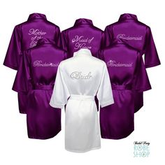 six robes in purple and white with the bride's name written on one side