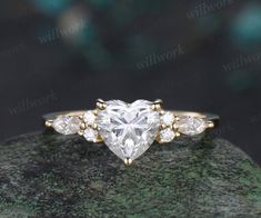 - Metal: Solid gold(10K/14K/18K white/yellow/rose gold),925 sterling silver,platinum available- Main Stone: 6.5mm Heart shaped moissanite- Accent Stone: diamonds or moissanites- Wedding Band Stone: diamonds or moissanites- Band Width: 1.4mm- Can be personalized: Yes Heart Engagement Ring, Heart Promise Rings, Moissanite Ring Set, Topaz Birthstone, Promise Ring Set, Rutilated Quartz Ring, Heart Engagement Rings, Silver Heart Ring, Moss Agate Ring