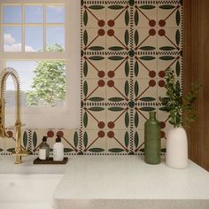 a bathroom with a sink, mirror and tiled wall in the backround area